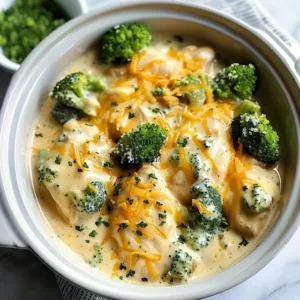 Crockpot creamy broccoli cheddar chicken dish with garnish on a wooden table