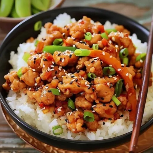 Dish of flavorful sesame ground chicken served with vegetables
