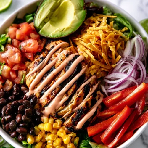 A vibrant Spicy Southwest Chicken Salad with grilled chicken and fresh vegetables.